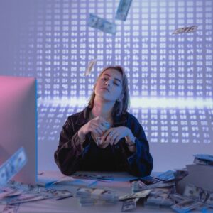 a confident woman holding bundles of cash money